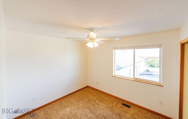 25 Amber, Dillon, MT 59725 - unfurnished room featuring light carpet, baseboards, and ceiling fan