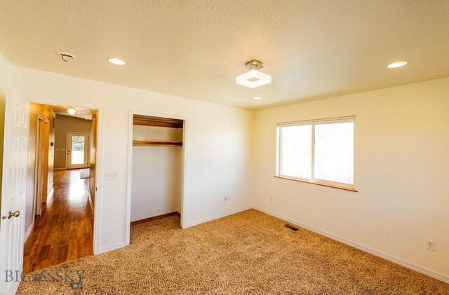 25 Amber, Dillon, MT 59725 - unfurnished bedroom with baseboards, carpet floors, a closet, and recessed lighting