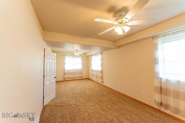 25 Amber, Dillon, MT 59725 - empty room featuring ceiling fan, carpet, and baseboards