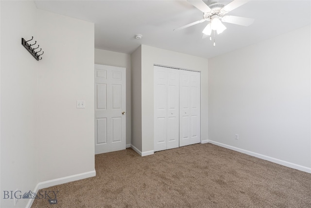 unfurnished bedroom featuring a closet, ceiling fan, and light colored carpet