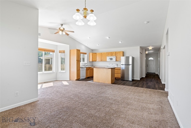 interior space with light brown cabinetry, ceiling fan with notable chandelier, white appliances, dark hardwood / wood-style flooring, and lofted ceiling