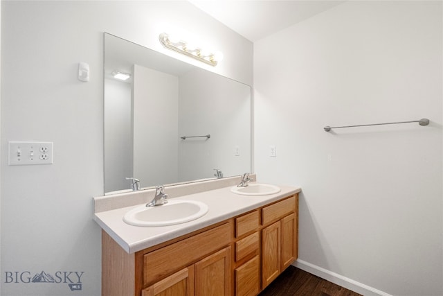 bathroom with vanity and hardwood / wood-style floors