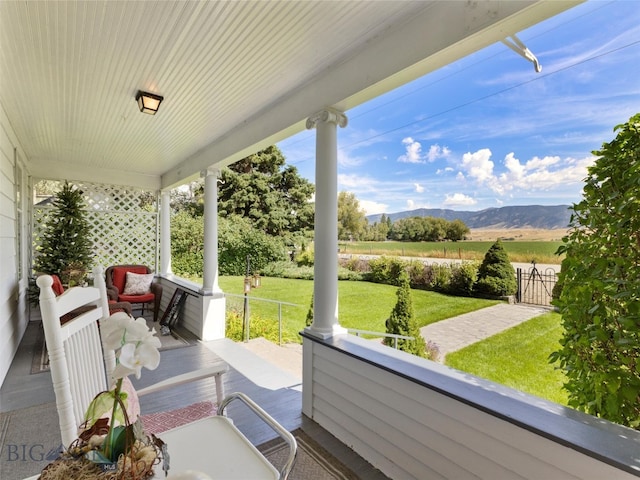 exterior space with a mountain view, a yard, and a rural view