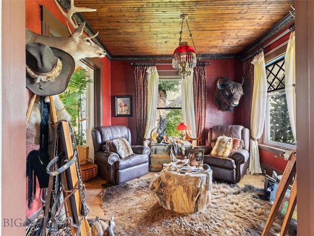 living area featuring wood-type flooring and wood ceiling