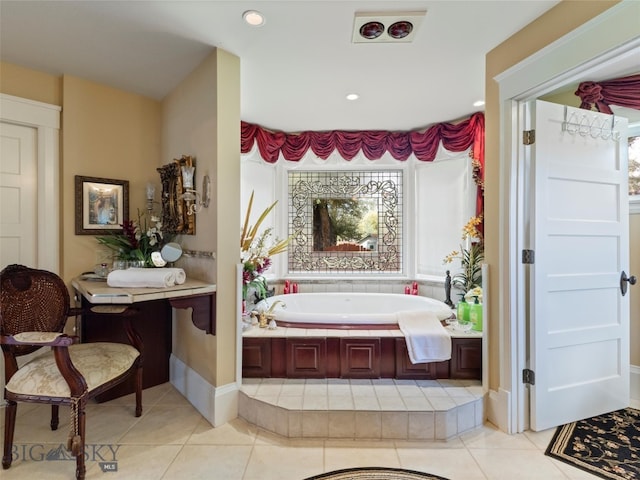 bathroom featuring a tub to relax in and tile patterned floors