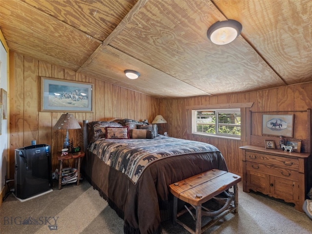 bedroom with carpet and wooden walls