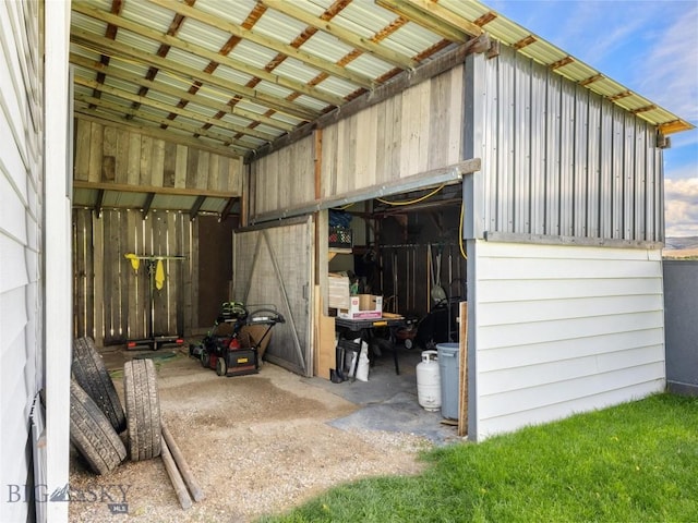 view of outbuilding featuring an outdoor structure and a garage