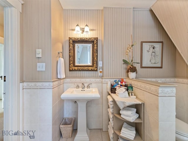 bathroom with tile walls and wainscoting