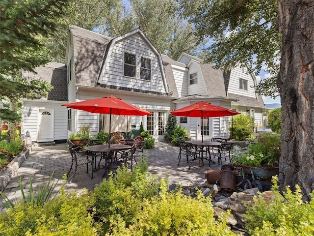 rear view of property with a patio area