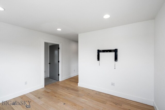 empty room with light hardwood / wood-style floors