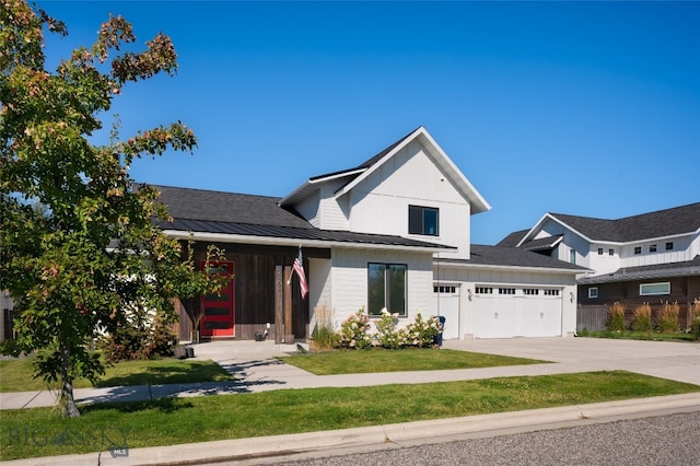 view of front facade featuring a garage and a front lawn