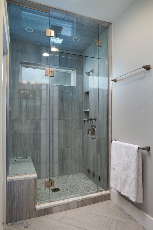 bathroom featuring plenty of natural light and walk in shower