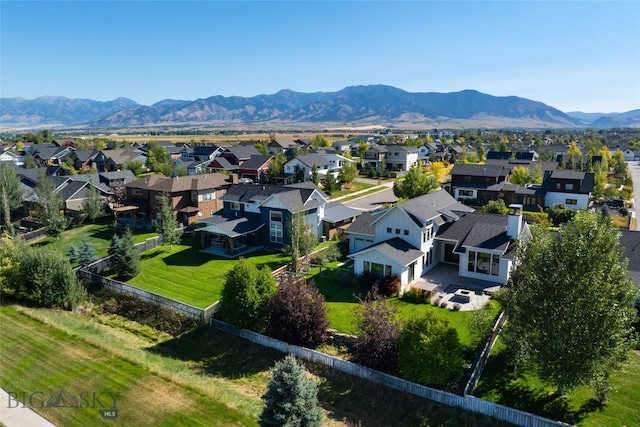 birds eye view of property with a mountain view