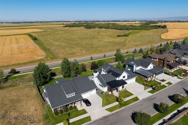 birds eye view of property with a rural view