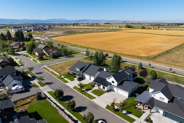 birds eye view of property with a mountain view