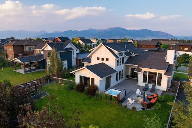 birds eye view of property featuring a mountain view