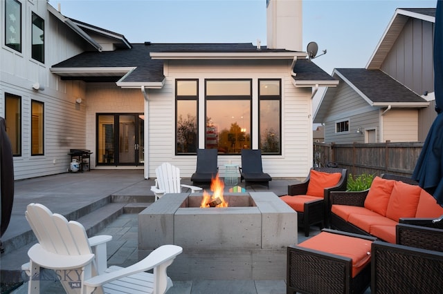 view of patio / terrace featuring an outdoor living space with a fire pit