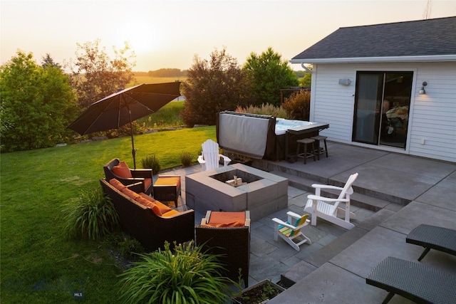 patio terrace at dusk with a yard and a fire pit