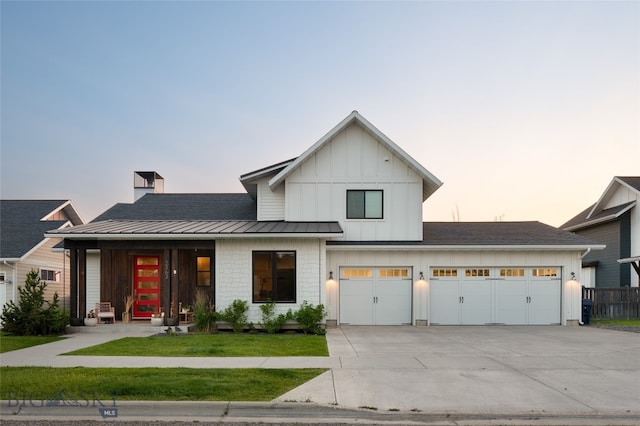 modern farmhouse featuring a lawn