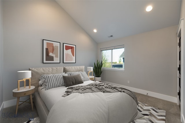 bedroom with vaulted ceiling and carpet