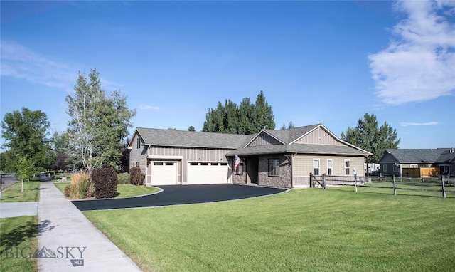 view of front of property with a garage and a front lawn