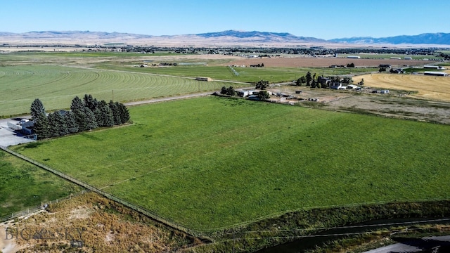 drone / aerial view featuring a mountain view and a rural view