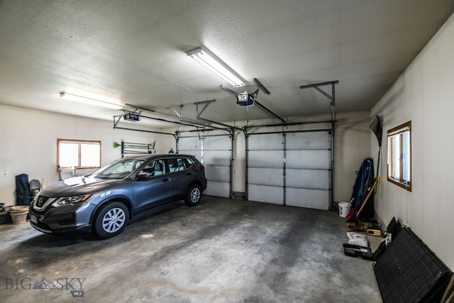 garage featuring a garage door opener