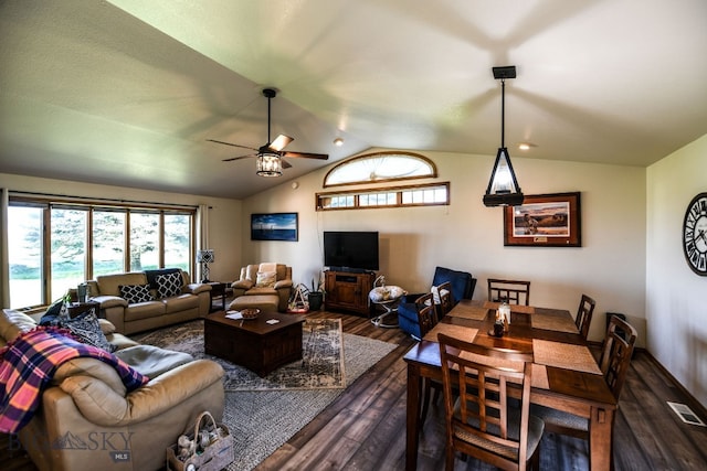 living room featuring lofted ceiling, dark hardwood / wood-style flooring, and ceiling fan