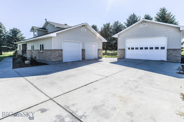 view of side of home featuring a garage