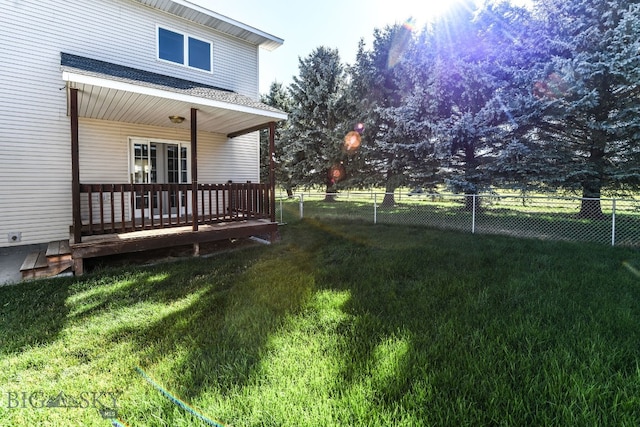 view of yard featuring a wooden deck