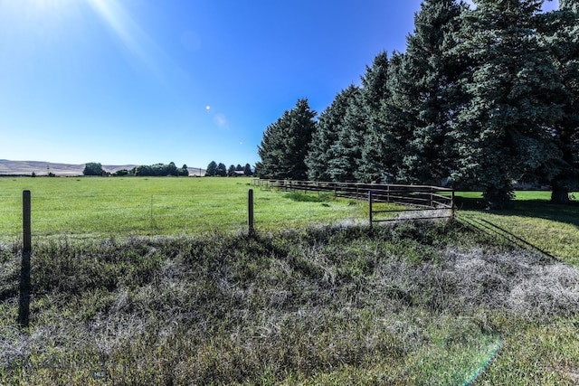 view of yard with a rural view