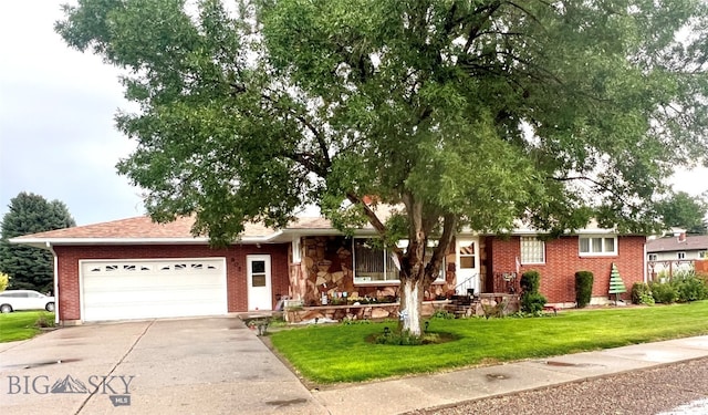 single story home with a front yard and a garage