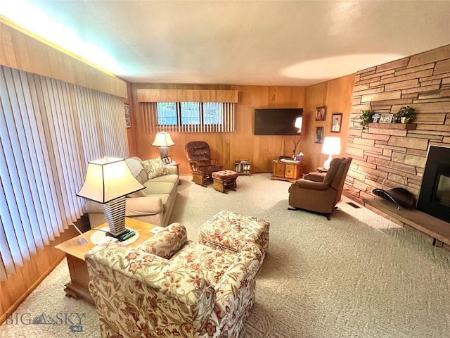 carpeted living room featuring a fireplace