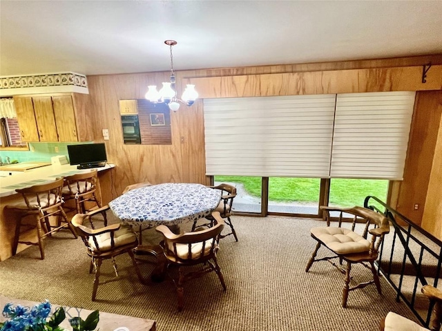 805 E Orr St, Dillon, MT 59725 - carpeted dining area with wooden walls and a chandelier