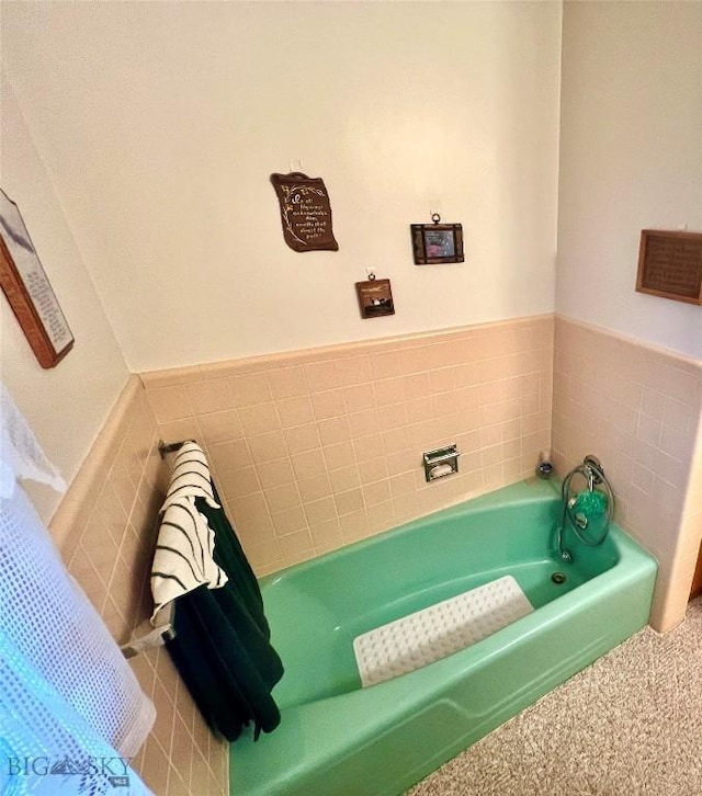 805 E Orr St, Dillon, MT 59725 - full bath with a wainscoted wall, tile walls, and a garden tub