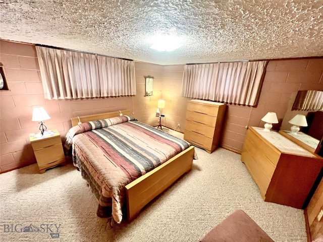 bedroom featuring light carpet and a textured ceiling