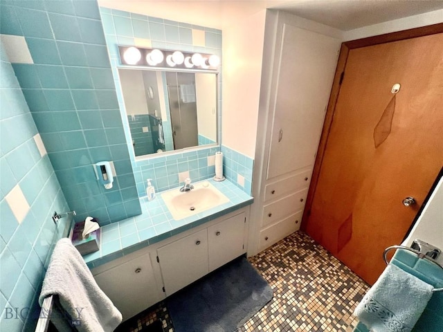 805 E Orr St, Dillon, MT 59725 - bathroom featuring tile patterned flooring, vanity, and tasteful backsplash