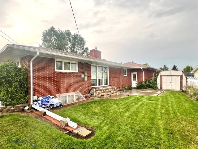 rear view of house featuring a storage shed, a lawn, and a patio