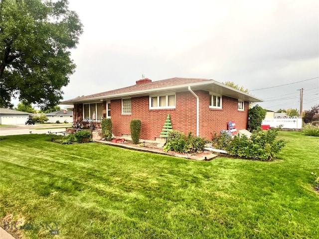 view of front of home with a front yard and a porch