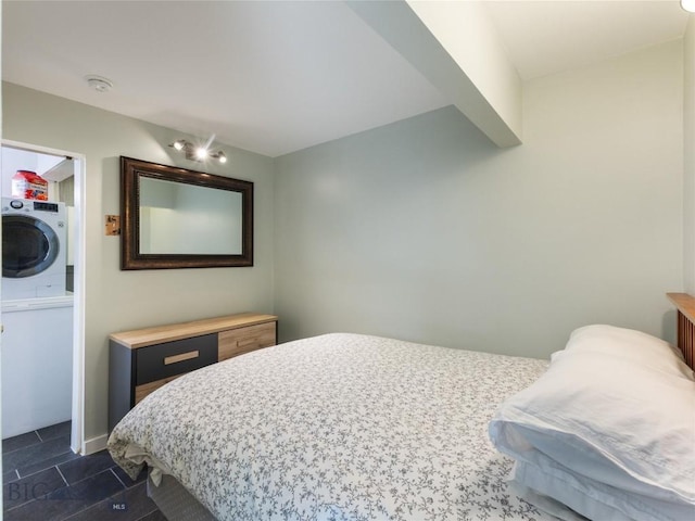 bedroom featuring stacked washing maching and dryer