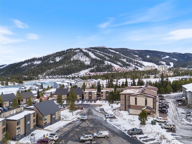 snowy aerial view featuring a mountain view