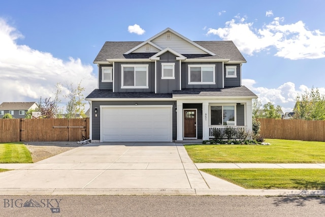 view of front of home featuring a garage and a front yard