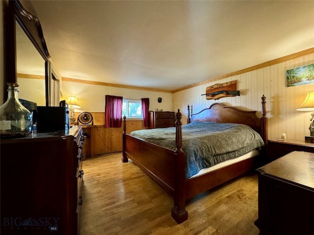 bedroom with light hardwood / wood-style floors