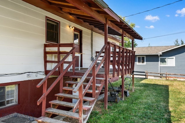 entrance to property featuring a yard