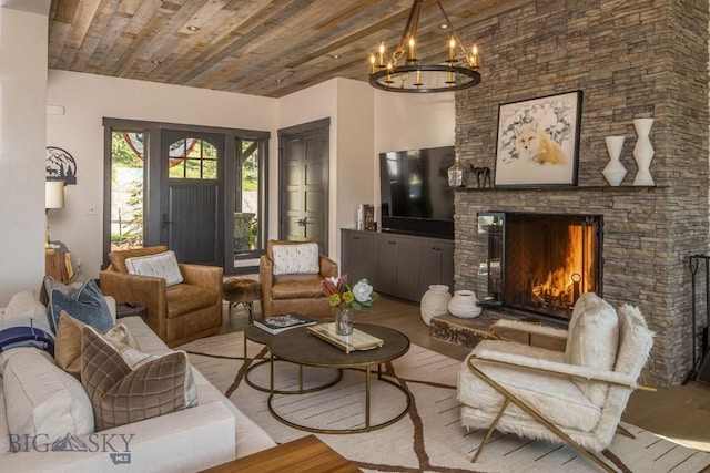 56 Outlook Trl, Big Sky, MT 59716 - living room featuring wooden ceiling, an inviting chandelier, a stone fireplace, and wood finished floors