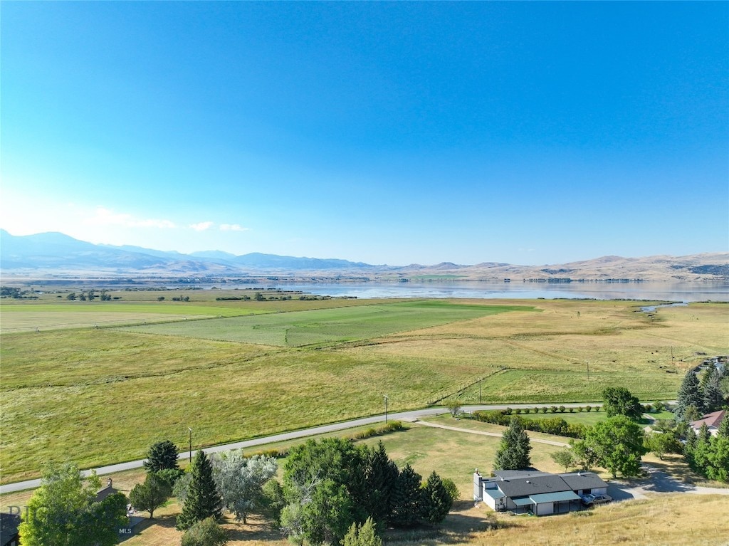 aerial view featuring a rural view and a water and mountain view