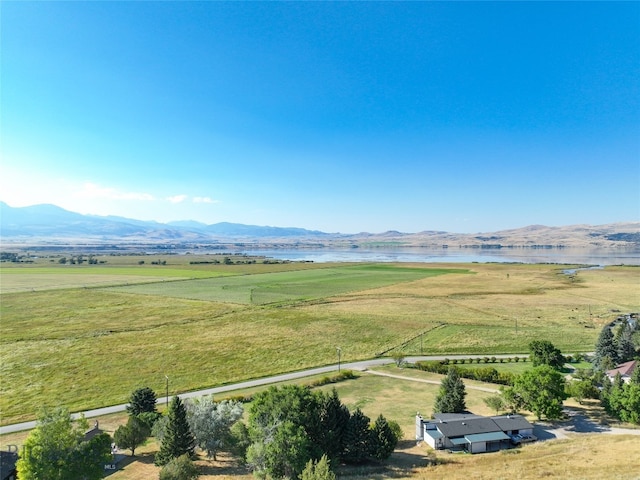 drone / aerial view featuring a mountain view and a rural view