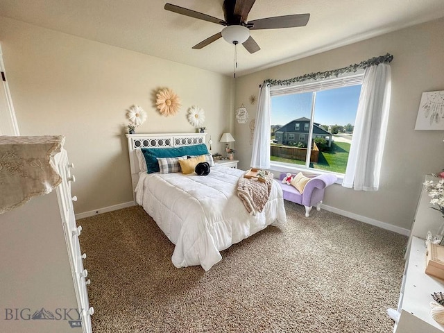 carpeted bedroom with ceiling fan and baseboards