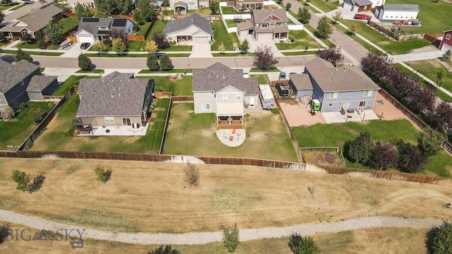 birds eye view of property with a residential view