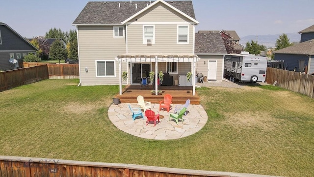 rear view of property with a patio area, a fenced backyard, a pergola, and a yard